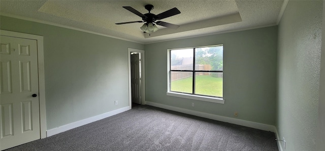 6436 Green Ridge Dr, Watauga, TX 76148 - unfurnished room with a textured ceiling, carpet floors, baseboards, crown molding, and ceiling fan