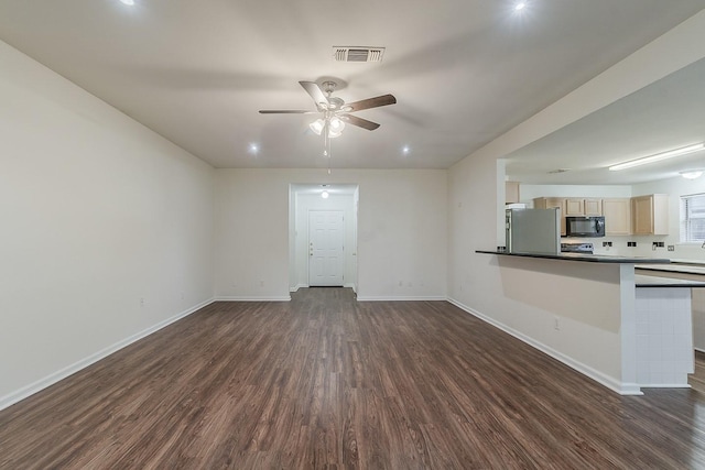 904 Havenbrook Dr, Arlington, TX 76001 - unfurnished living room featuring dark wood-type flooring, ceiling fan, and baseboards