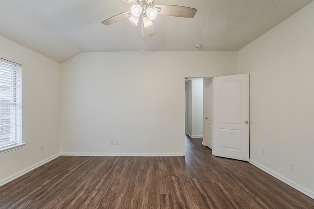 904 Havenbrook Dr, Arlington, TX 76001 - spare room with dark wood-type flooring, a ceiling fan, baseboards, lofted ceiling, and a textured ceiling