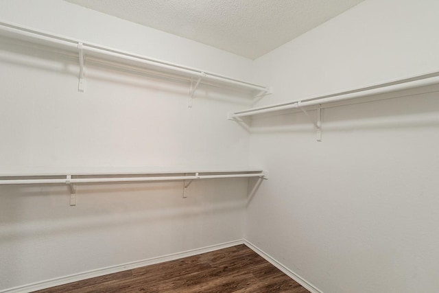 904 Havenbrook Dr, Arlington, TX 76001 - spacious closet featuring dark wood-type flooring