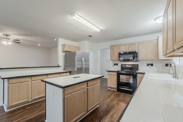 904 Havenbrook Dr, Arlington, TX 76001 - kitchen featuring black appliances, light brown cabinets, a center island, a sink, and dark wood-style floors