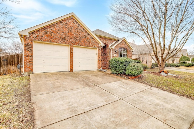 8016 Pretoria Pl, Fort Worth, TX 76123 - view of front of home featuring an attached garage, concrete driveway, and brick siding