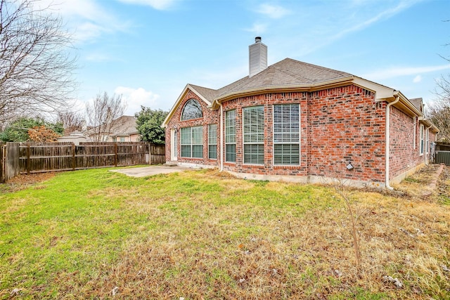 8016 Pretoria Pl, Fort Worth, TX 76123 - back of house featuring brick siding, a chimney, and a patio