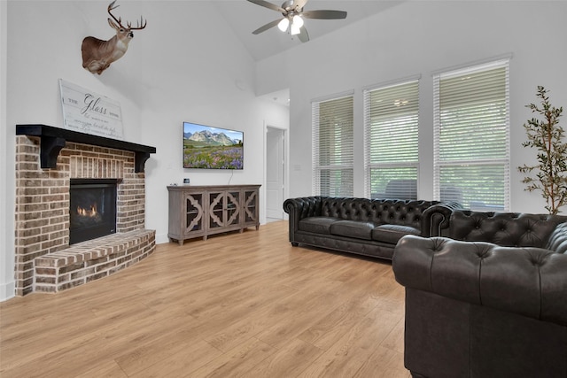 4166 Carter Ct, Denison, TX 75020 - living room with a ceiling fan, wood finished floors, high vaulted ceiling, and a fireplace
