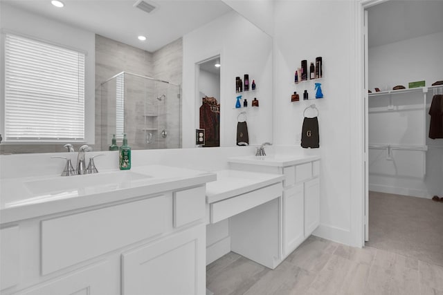 4166 Carter Ct, Denison, TX 75020 - bathroom featuring a shower stall, vanity, a walk in closet, and recessed lighting