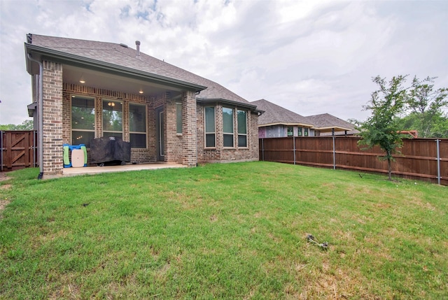 4166 Carter Ct, Denison, TX 75020 - rear view of property with brick siding, a patio, and roof with shingles