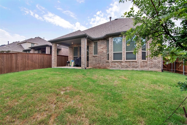 4166 Carter Ct, Denison, TX 75020 - rear view of house with brick siding and a shingled roof