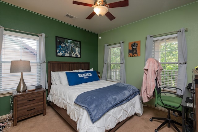 1621 Jasmine Trl, Savannah, TX 76227 - carpeted bedroom featuring multiple windows, a ceiling fan, and an office area