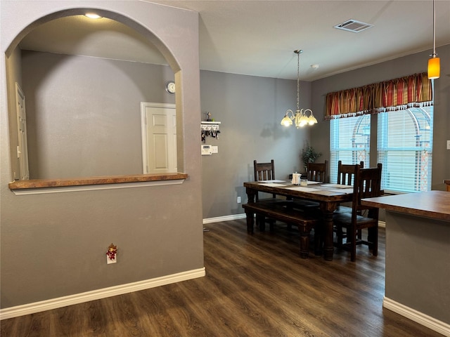 1621 Jasmine Trl, Savannah, TX 76227 - dining area featuring arched walkways, dark wood-style floors, and a chandelier