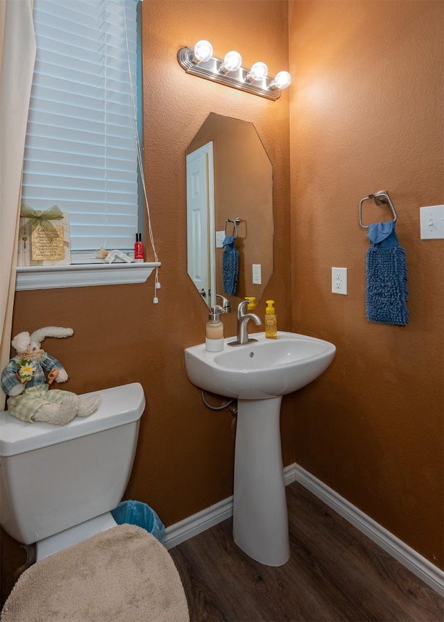 1621 Jasmine Trl, Savannah, TX 76227 - half bath featuring wood finished floors and toilet