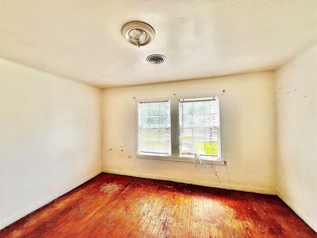 801 W State St, Groesbeck, TX 76642 - spare room with hardwood / wood-style floors and baseboards
