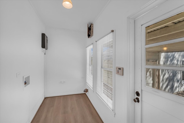 2700 Pine Ave, Waco, TX 76708 - doorway to outside featuring wood finished floors and baseboards