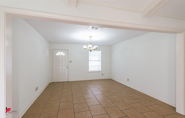 9104 Rosedown Cir, Shreveport, LA 71118 - entrance foyer with a chandelier, light tile patterned floors, and baseboards