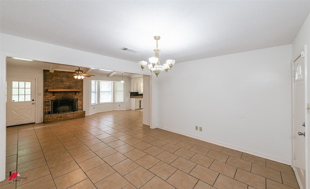 9104 Rosedown Cir, Shreveport, LA 71118 - unfurnished living room with a chandelier, light tile patterned floors, a fireplace, a ceiling fan, and baseboards
