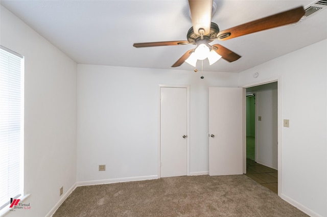 9104 Rosedown Cir, Shreveport, LA 71118 - unfurnished bedroom with carpet floors, a ceiling fan, and baseboards