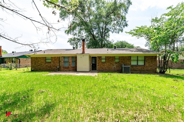 9104 Rosedown Cir, Shreveport, LA 71118 - back of property with brick siding, a patio, and central AC