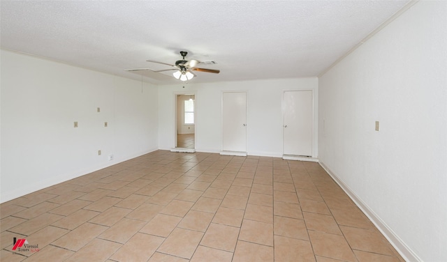 9104 Rosedown Cir, Shreveport, LA 71118 - spare room featuring a ceiling fan, a textured ceiling, baseboards, and light tile patterned floors
