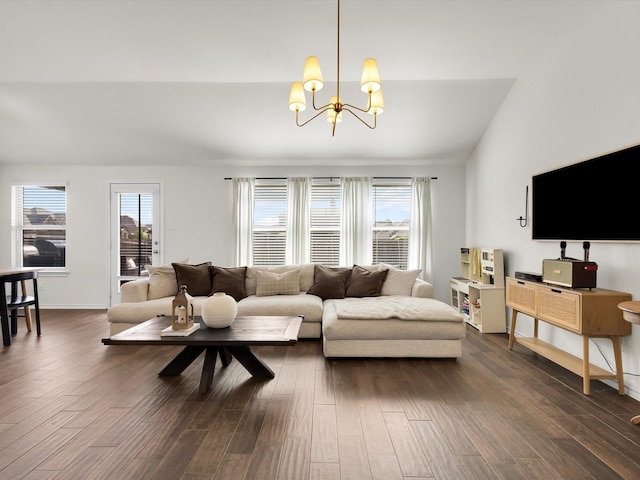 1519 Old Wichita Trl, Saginaw, TX 76131 - living room featuring a chandelier, dark wood-style flooring, and baseboards