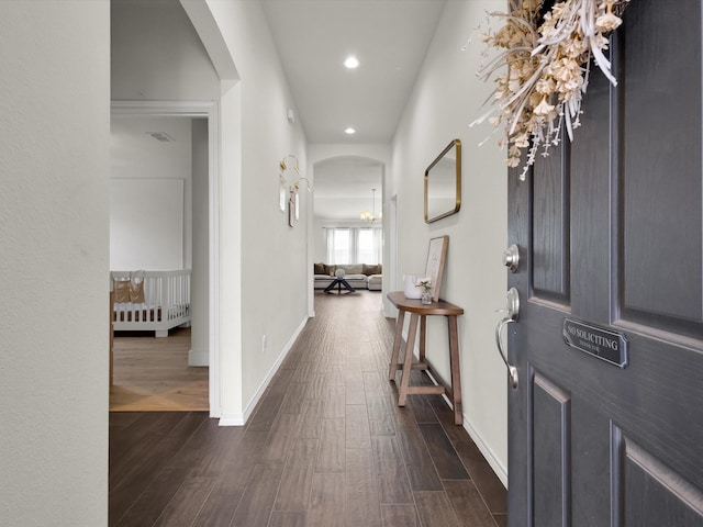 1519 Old Wichita Trl, Saginaw, TX 76131 - foyer with arched walkways, dark wood-style floors, recessed lighting, and baseboards