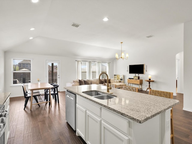 1519 Old Wichita Trl, Saginaw, TX 76131 - kitchen with a sink, open floor plan, stainless steel appliances, a chandelier, and dark wood-style floors