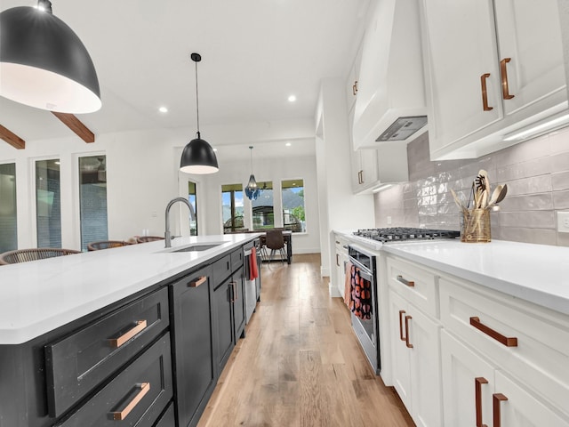 1117 Mountain View Dr, Weatherford, TX 76087 - kitchen with a sink, white cabinetry, stainless steel appliances, light wood-type flooring, and recessed lighting