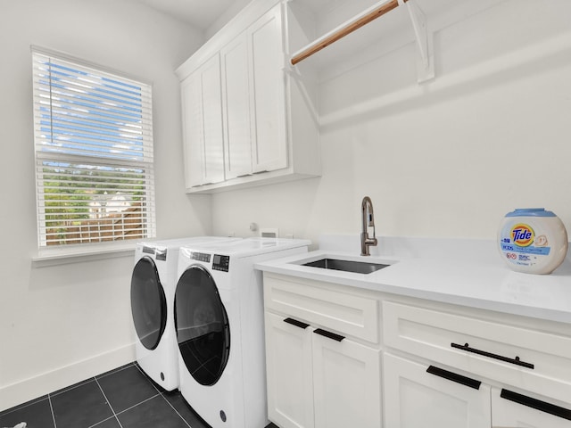 1117 Mountain View Dr, Weatherford, TX 76087 - laundry area featuring washer and clothes dryer, cabinet space, dark tile patterned floors, and baseboards