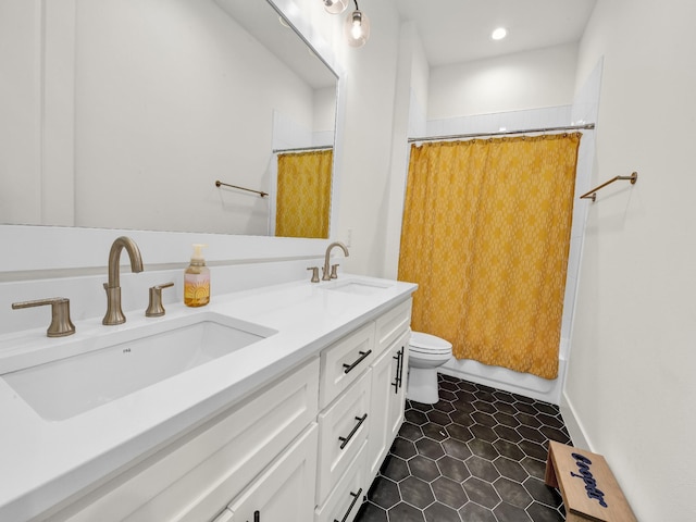 1117 Mountain View Dr, Weatherford, TX 76087 - bathroom with toilet, double vanity, tile patterned floors, recessed lighting, and shower / bath combo