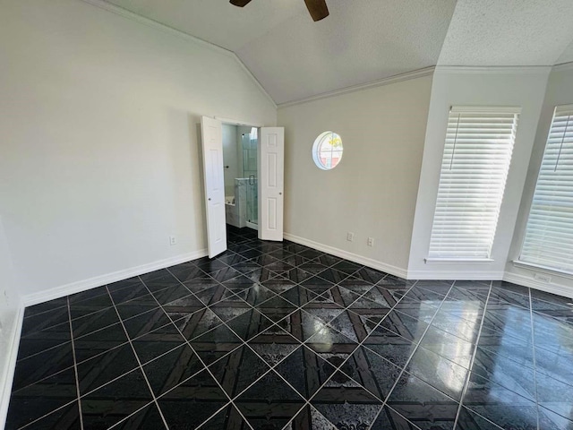 520 Timber Way Dr, Lewisville, TX 75067 - unfurnished room featuring ceiling fan, lofted ceiling, crown molding, dark tile patterned floors, and baseboards
