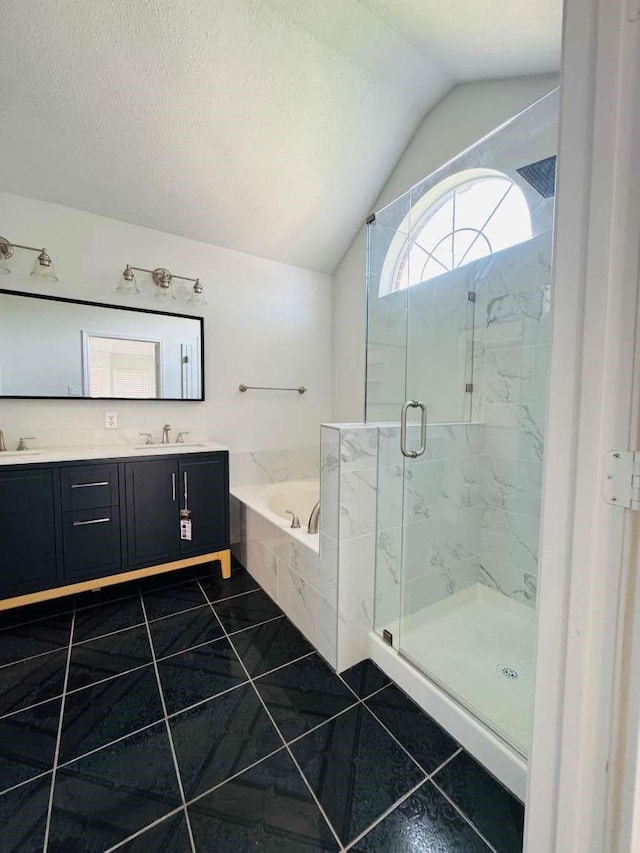 520 Timber Way Dr, Lewisville, TX 75067 - full bath with vaulted ceiling, a bath, a marble finish shower, double vanity, and tile patterned floors