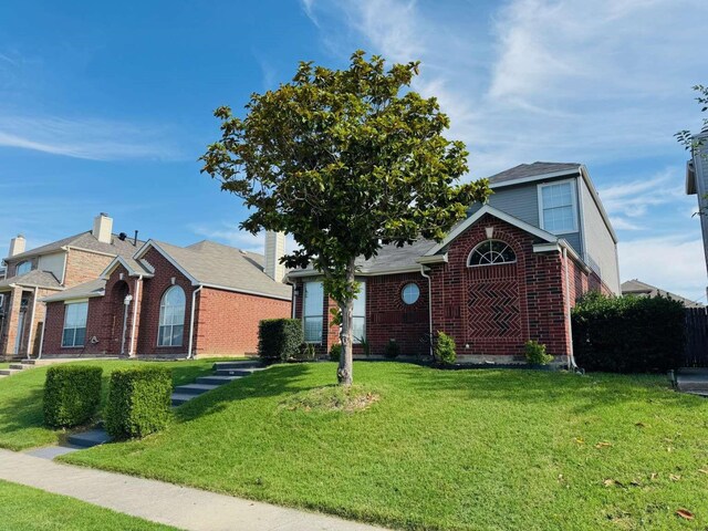 520 Timber Way Dr, Lewisville, TX 75067 - view of front of home with brick siding and a front lawn