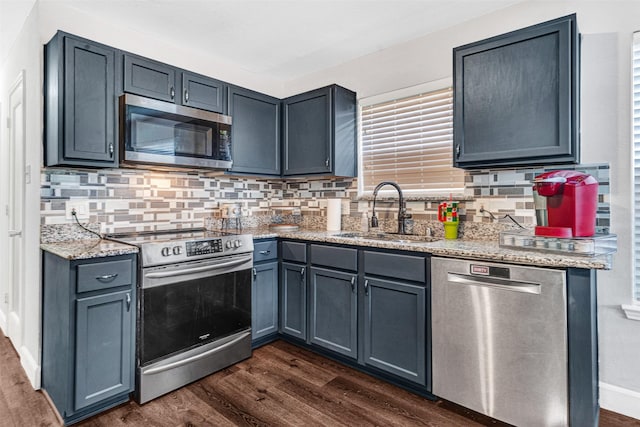 912 Thistle Cir, Allen, TX 75002 - kitchen with appliances with stainless steel finishes, a sink, and dark wood-style flooring