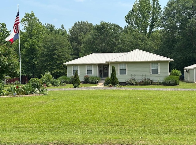 33 County Road 1131, Maud, TX 75567 - view of front of home with a front yard and metal roof
