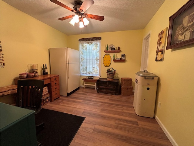 33 County Road 1131, Maud, TX 75567 - office featuring a ceiling fan, wood finished floors, a textured ceiling, and baseboards