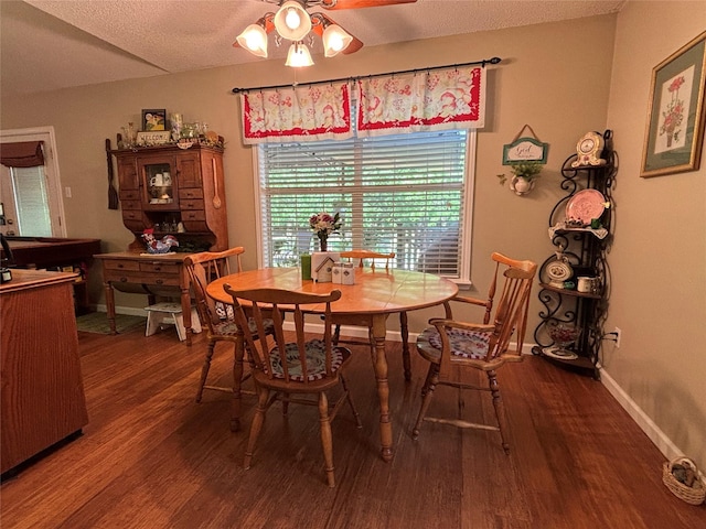 33 County Road 1131, Maud, TX 75567 - dining room featuring wood finished floors, ceiling fan, baseboards, and a textured ceiling