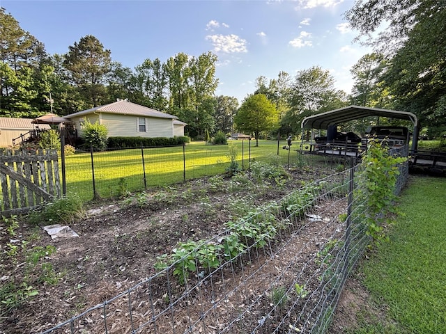 33 County Road 1131, Maud, TX 75567 - view of yard featuring a detached carport and view of wooded area
