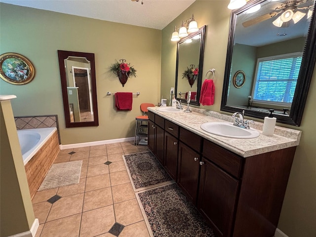 33 County Road 1131, Maud, TX 75567 - full bathroom with tile patterned floors, a ceiling fan, double vanity, a bathtub, and baseboards