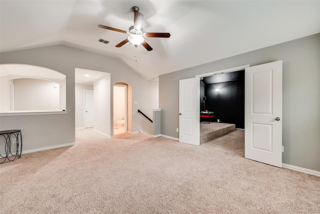 11701 Parade Dr, Frisco, TX 75036 - carpeted empty room featuring ceiling fan, lofted ceiling, baseboards, and arched walkways