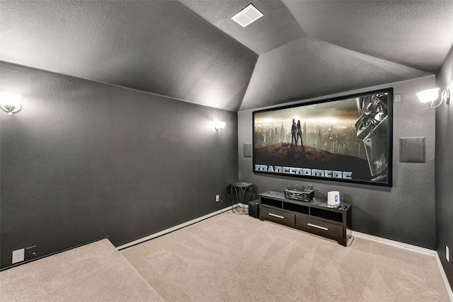 11701 Parade Dr, Frisco, TX 75036 - home theater with carpet, lofted ceiling, baseboards, and a textured ceiling
