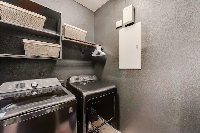 11701 Parade Dr, Frisco, TX 75036 - washroom with separate washer and dryer and a textured wall