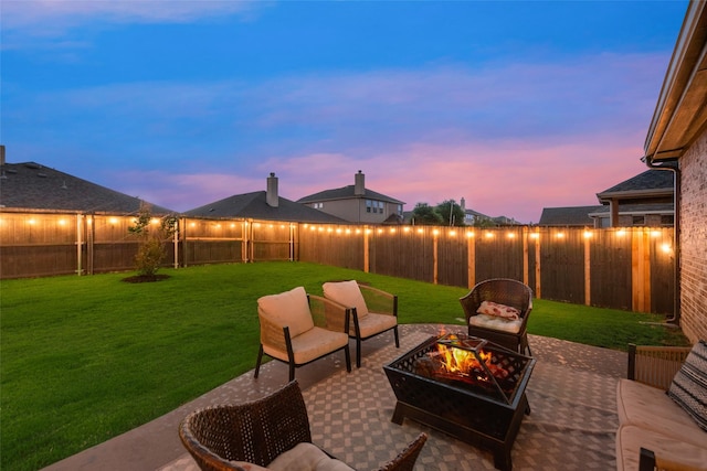 11701 Parade Dr, Frisco, TX 75036 - patio terrace at dusk featuring an outdoor fire pit and a patio area