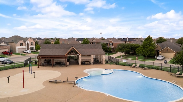 11701 Parade Dr, Frisco, TX 75036 - community pool with a residential view and a patio area