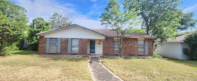 9641 Sophora Cir, Dallas, TX 75249 - ranch-style home with brick siding and a front yard