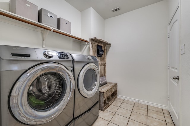 7812 Rancho De La Osa Trl, Mckinney, TX 75070 - washroom with washing machine and clothes dryer, baseboards, and light tile patterned floors