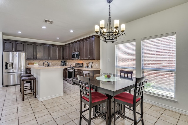 7812 Rancho De La Osa Trl, Mckinney, TX 75070 - dining space featuring a chandelier, light tile patterned floors, recessed lighting, and baseboards