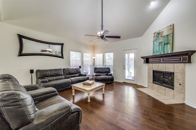 7812 Rancho De La Osa Trl, Mckinney, TX 75070 - living area with lofted ceiling, ceiling fan, wood finished floors, a tiled fireplace, and baseboards