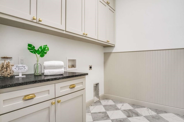 407 Baldwin Dr, Joshua, TX 76058 - laundry room featuring electric dryer hookup, cabinet space, wainscoting, hookup for a washing machine, and baseboards