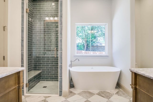 407 Baldwin Dr, Joshua, TX 76058 - full bath with vanity, a shower stall, a freestanding tub, and marble finish floors