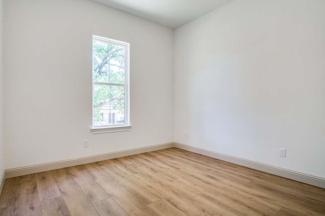407 Baldwin Dr, Joshua, TX 76058 - spare room with light wood-style flooring and baseboards