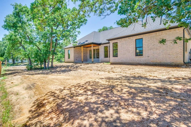407 Baldwin Dr, Joshua, TX 76058 - back of property with brick siding and roof with shingles