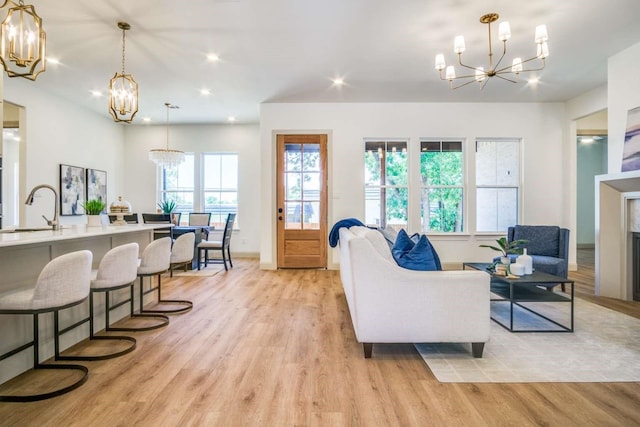 407 Baldwin Dr, Joshua, TX 76058 - living area featuring a chandelier, light wood-type flooring, recessed lighting, and baseboards